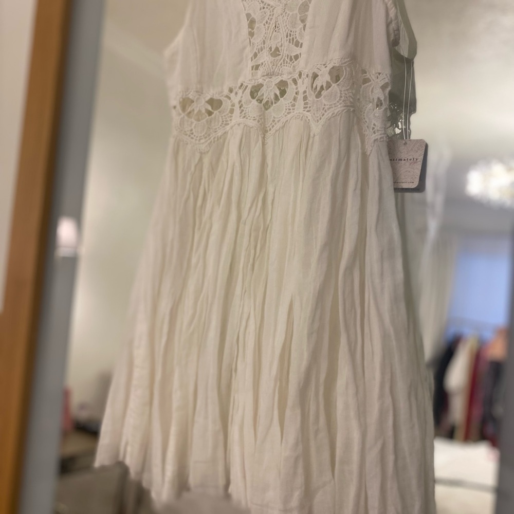 Free people intimately white dress it has some crochet details  brand new